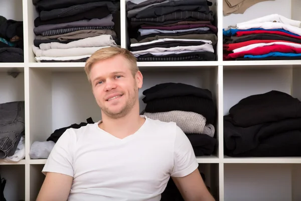 Young man with his wardrobe — Stock Photo, Image